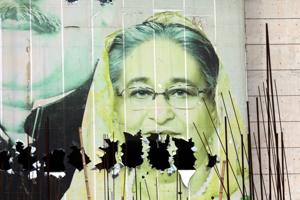 A vandalized image of Prime Minister Sheikh Hasina in the aftermath of her resignation, in Dhaka, Bangladesh. The army has taken control of the government pending an election. Photo: EPA-EFE