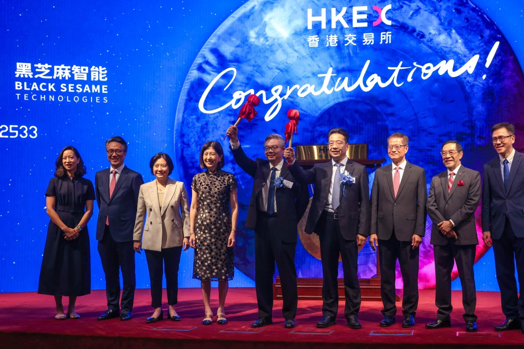 Black Sesame’s co-founders Shan Jizhang and Liu Weihong pose with HKEX officials and special guests, after striking the gong to mark its market debut. Photo: Jonathan Wong