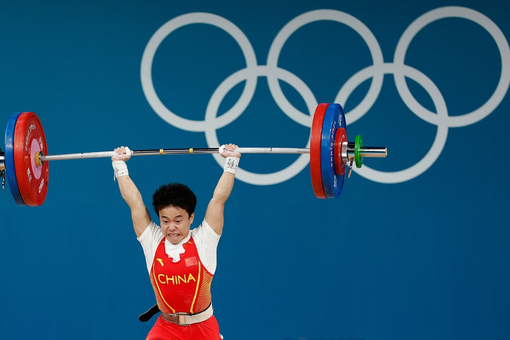 Hou Zhihui of China lifts her way to gold in the women’s 49kg competition. Photo: Xinhua