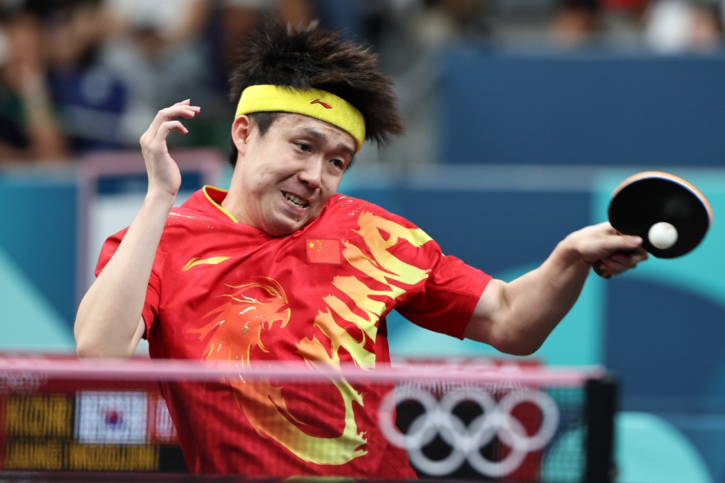 Wang Chunqin competes against Jang Woojin of South Korea during the men’s team quarter-final. Photo: Xinhua