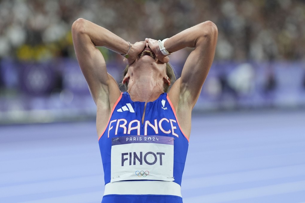 Alice Finot can’t hide her joy after breaking the European record in the women’s 3000 metres steeplechase in Paris. Photo: AP