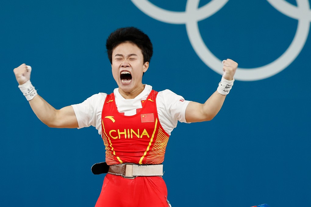 Hou Zhihui celebrates after winning the women’s 49kg weightlifting event. Photo: Xinhua