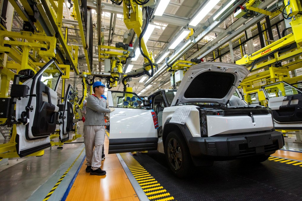 Employees work on the production line at a factory for Chery’s electric vehicles in Wuhu, Anhui province. Photo: Reuters