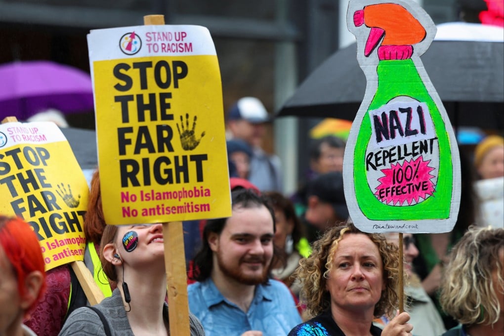 People take part in a rally supporting migrants and refugees and opposing recent anti-immigration protests, in Brighton. Photo: Reuters