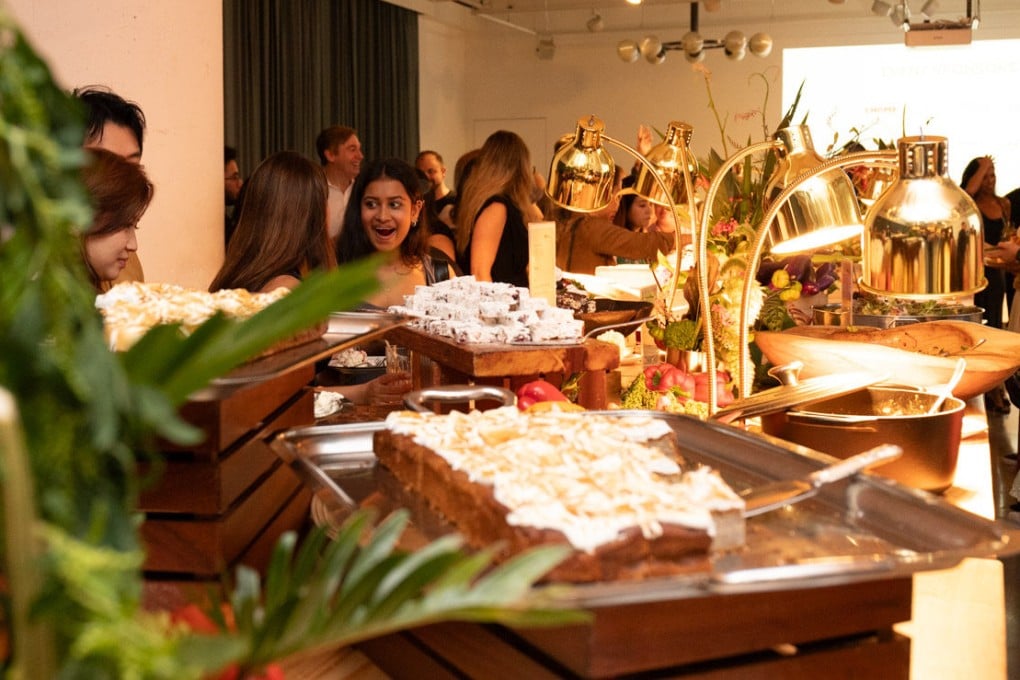 Guests tuck into dishes from a buffet Soho House chef Chris Czerwinski and Chomp app founder Carla Martinesi put on using discarded food to highlight Hong Kong’s food waste problem. Photo: The Rescued Feast