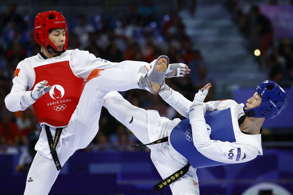 Lo Wai-fung of Hong Kong aims to outmanoeuvre Liang Yushuai of China during Thursday’s bout. Photo: Reuters