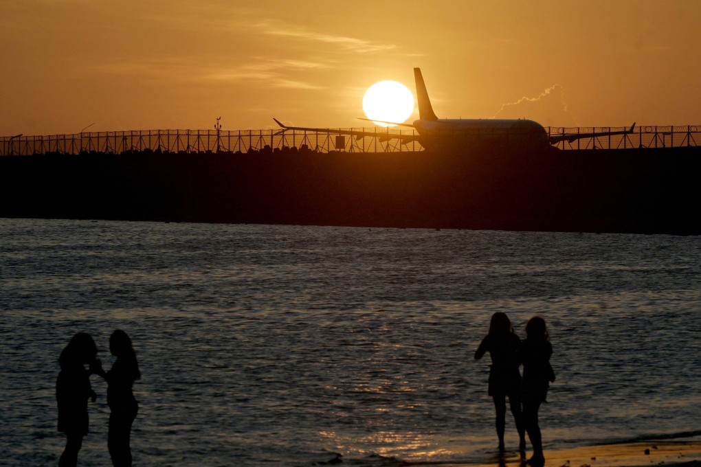 People watch the sunset from a beach in Bali, Indonesia. A business group said building a casino on the island would boost the tourist hub’s income by up to US$809 million. Photo: AFP