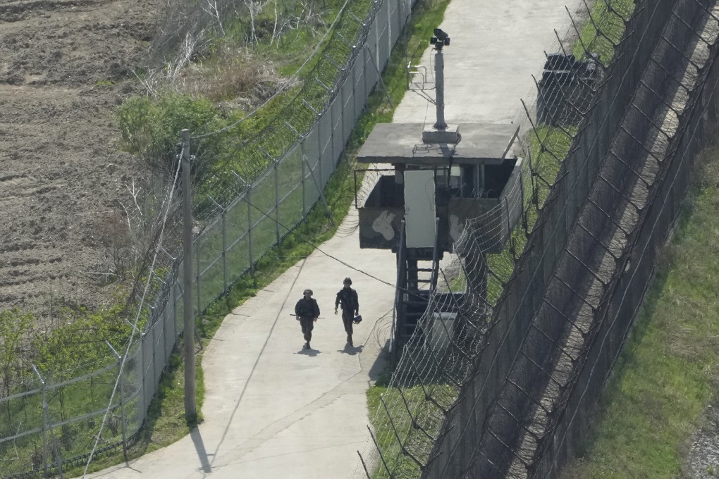 South Korean soldiers patrol along the barbed-wire fence in Paju, near the border with the North. Photo: AP