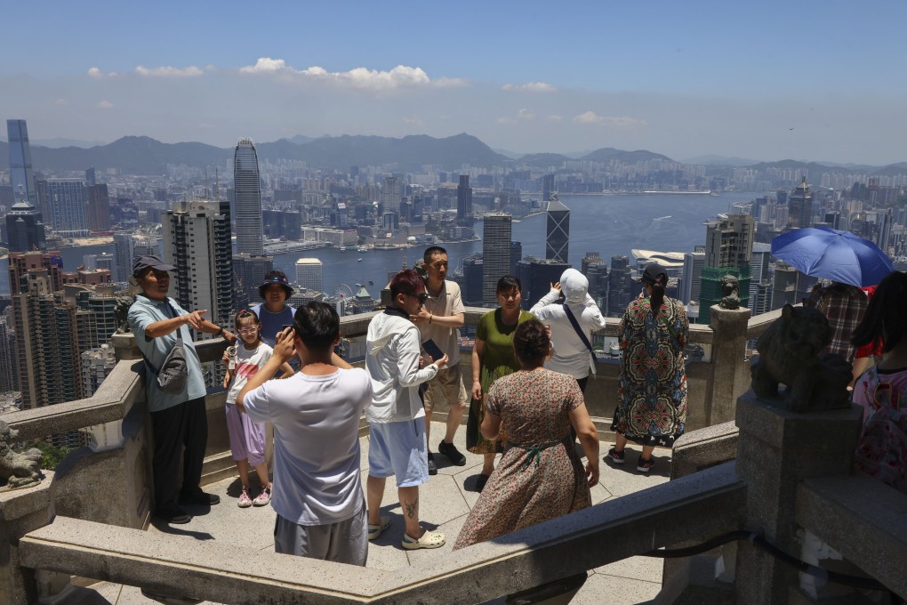 Tourists on The Peak. Government figures show the value of retail sales has been falling since March. Photo: Dickson Lee