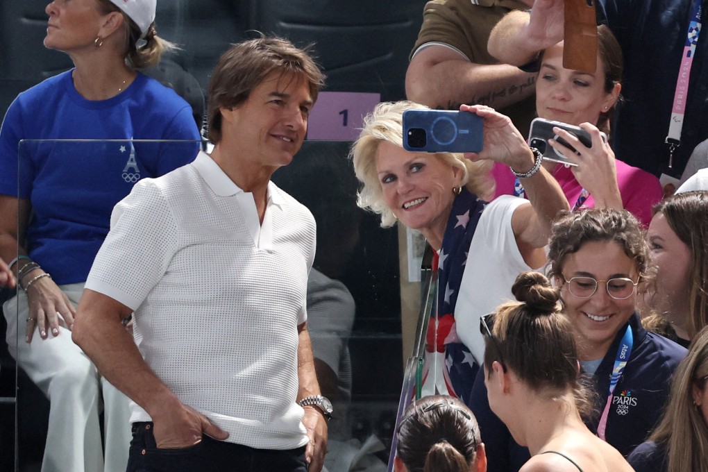 Actor Tom Cruise, seen here with fans at the gymnastics, is reportedly performing a daredevil stunt at the closing ceremony. Photo: Reuters