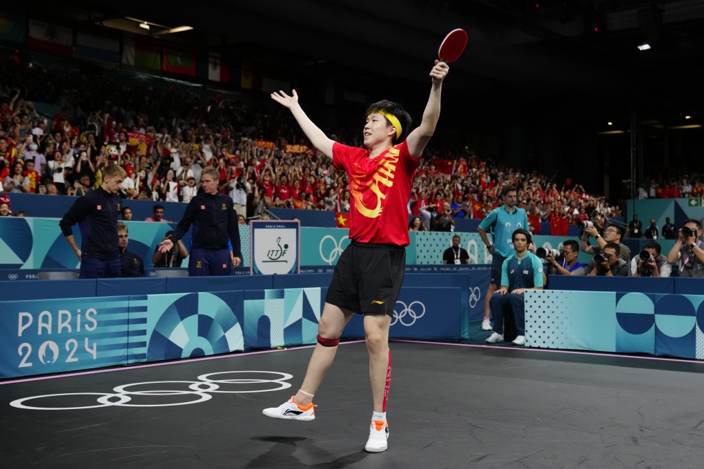 China’s Wang Chuqin celebrates after beating Sweden’s Kristian Karlsson in the men’s gold medal team table tennis match. Photo: AP