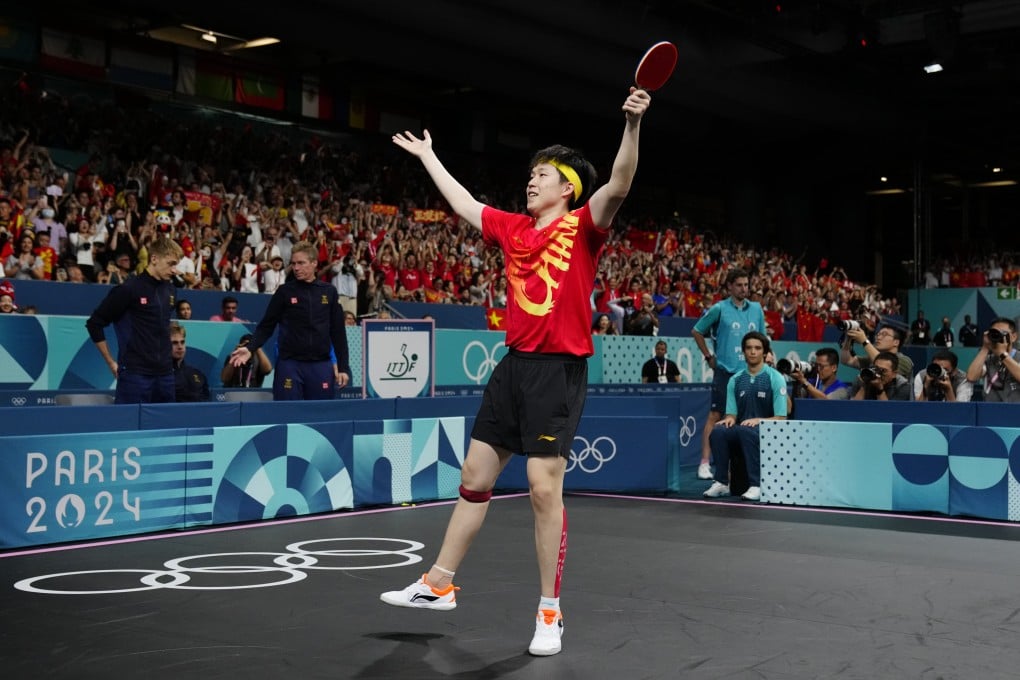 China’s Wang Chuqin celebrates after beating Sweden’s Kristian Karlsson in the men’s gold medal team table tennis match. Photo: AP