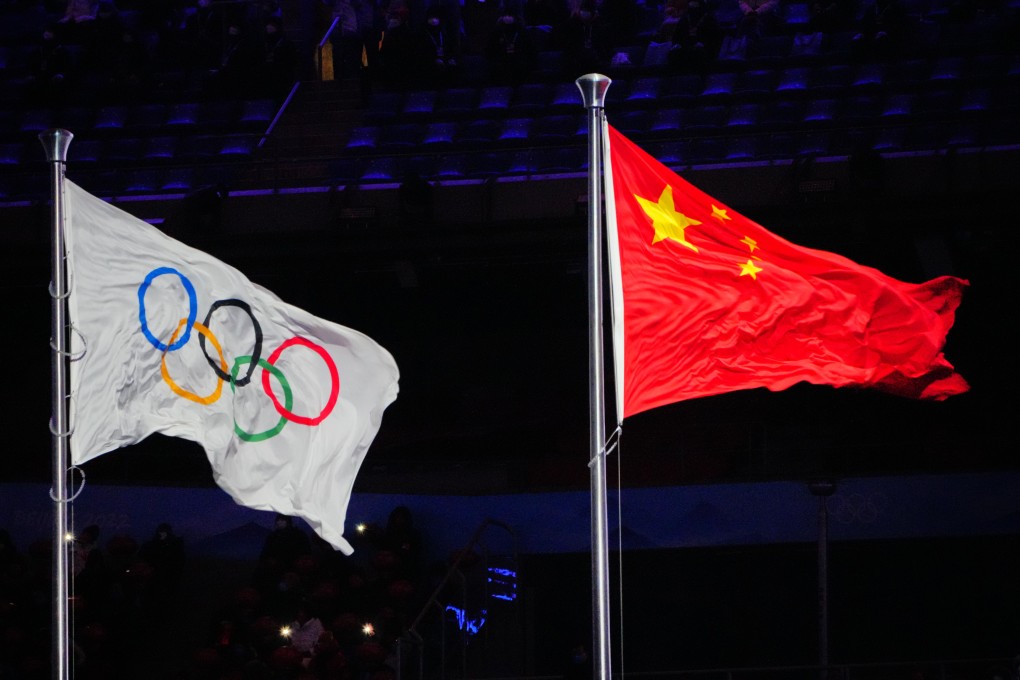 The flags of China and the Olympics flutter at the Beijing 2022 Winter Olympic Games. Togetherness at the Paris 2024 Olympics has been in short supply amid claims about doping, especially targeting Chinese athletes. Photo: dpa