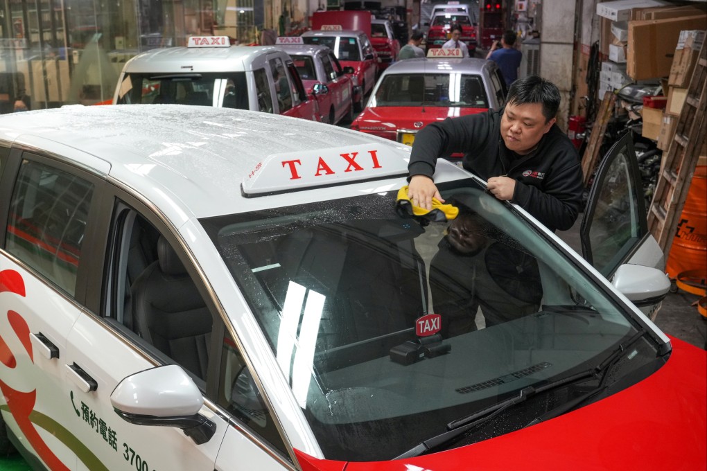 An employee of a taxi service cleans one of the company’s newest cars in To Kwa Wan on July 31. Hong Kong’s taxi licencing scheme will not allocate extra resources, but rather reshuffle those the city already has. Photo: May Tse