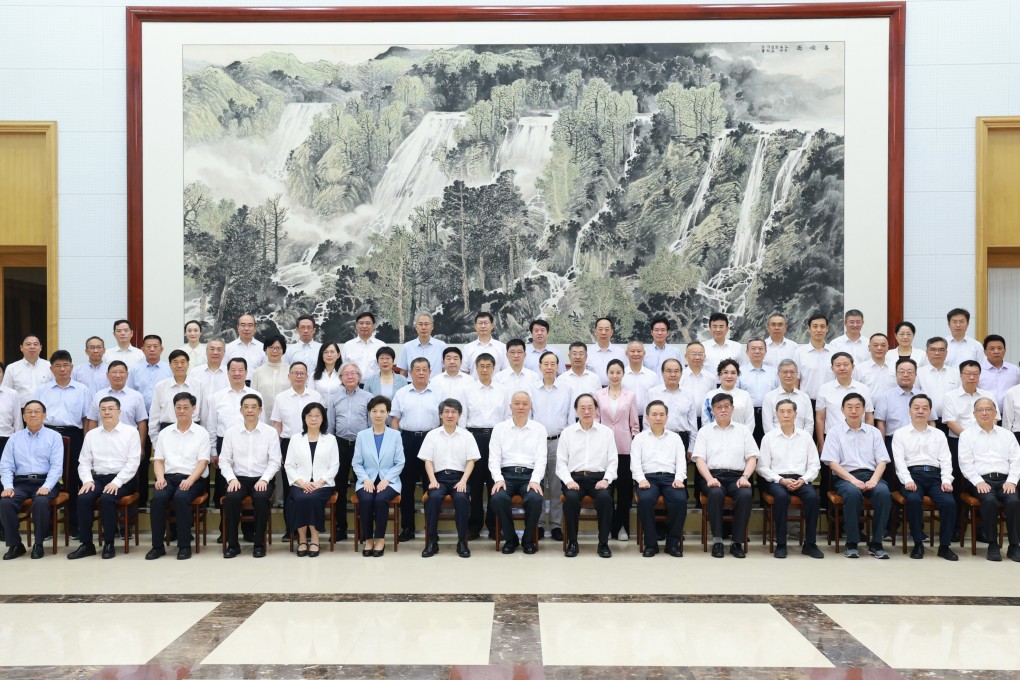 Politburo member Cai Qi (seated centre) was on hand to greet dozens of prominent researchers in Beidaihe, Hebei province, on August 3. Photo: Xinhua