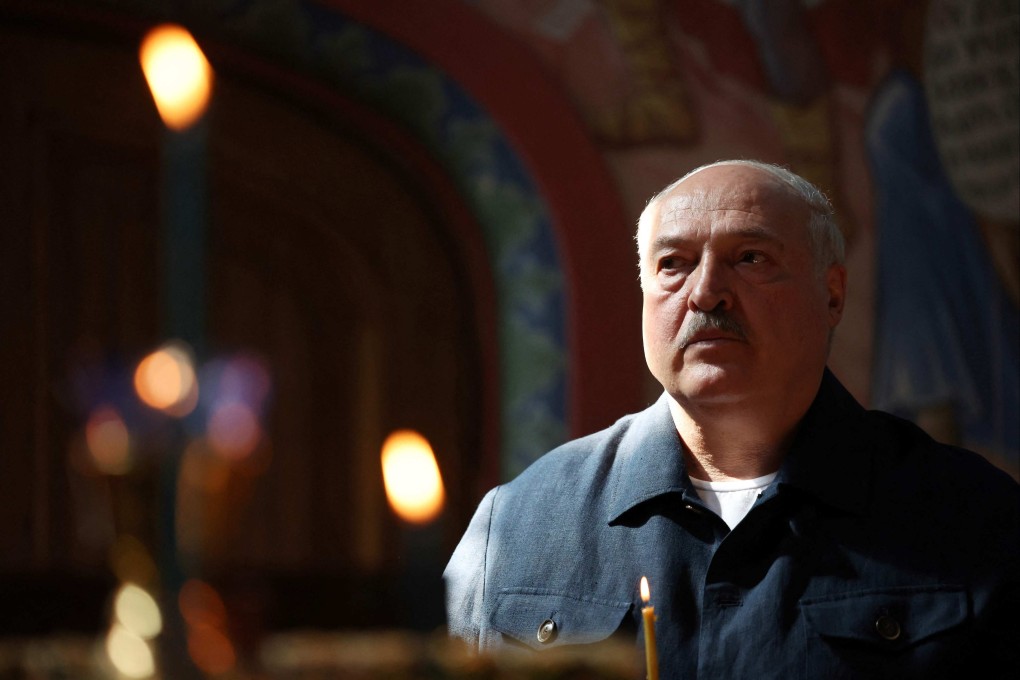 Belarusian President Alexander Lukashenko, a close ally of Russian President Vladimir Putin, holds a candle as he visits Valaam Monastery in northern Russia in July. Photo: AFP