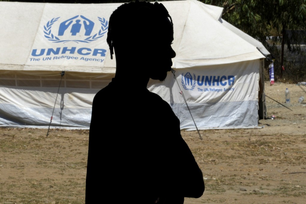 A refugee stands in front of a tent at a camp inside the UN-controlled buffer zone that divides the north part of the Turkish-occupied area from the south Greek Cypriots at the Aglantzia area in Nicosia, Cyprus, on August 9. In a world where developed economies face dire demographic challenges, international migrants are likely to play a key role in continued economic growth. Photo: AP