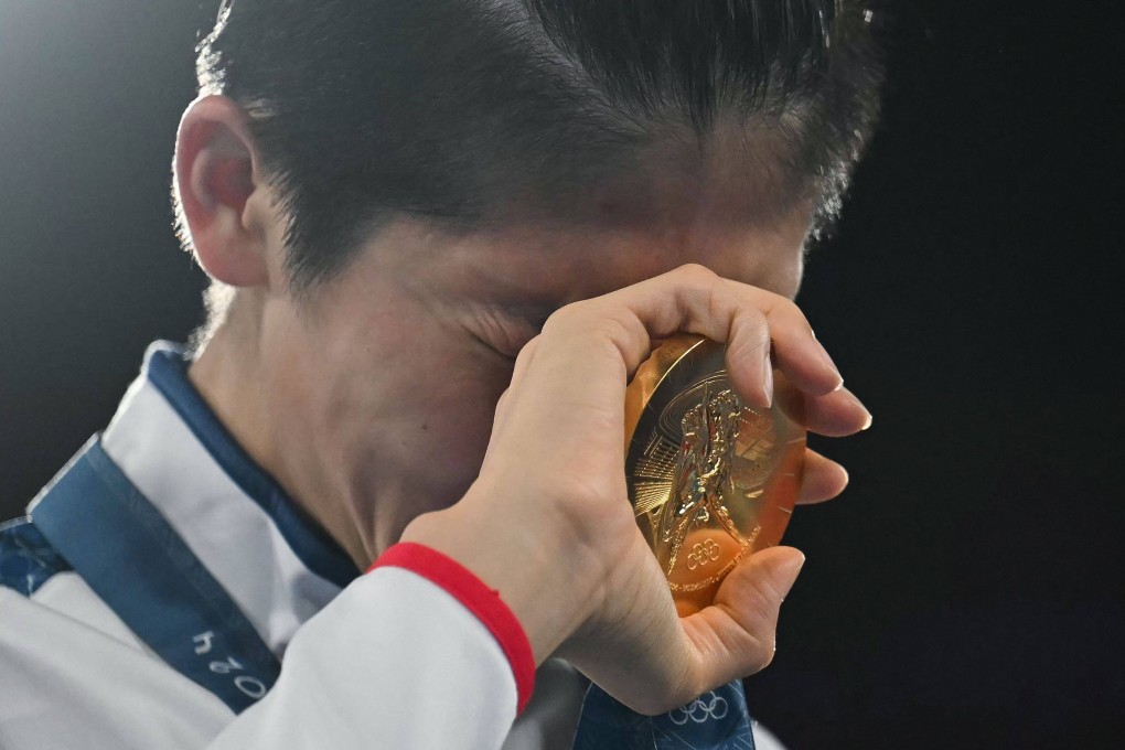 Gold medallist Lin Yu-ting is overcome on the podium after winning the women’s boxing 57kg final. Photo: AFP