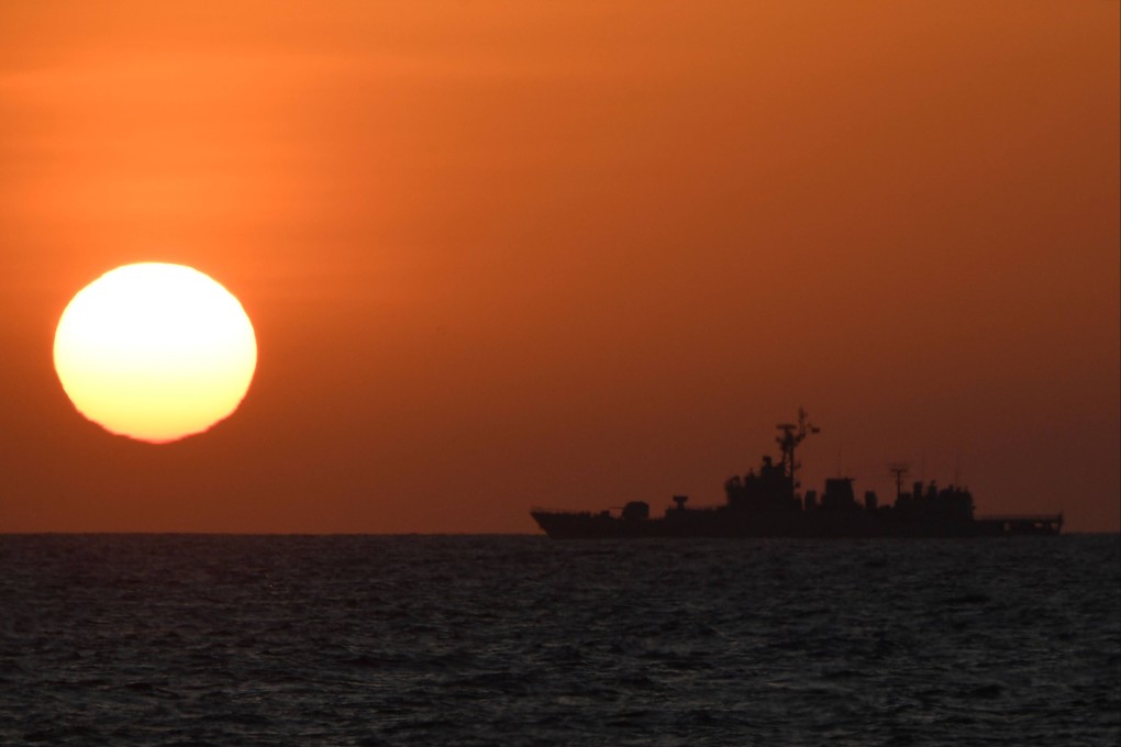 A Chinese navy ship sails near the Scarborough Shoal in the disputed South China Sea. Photo: AFP
