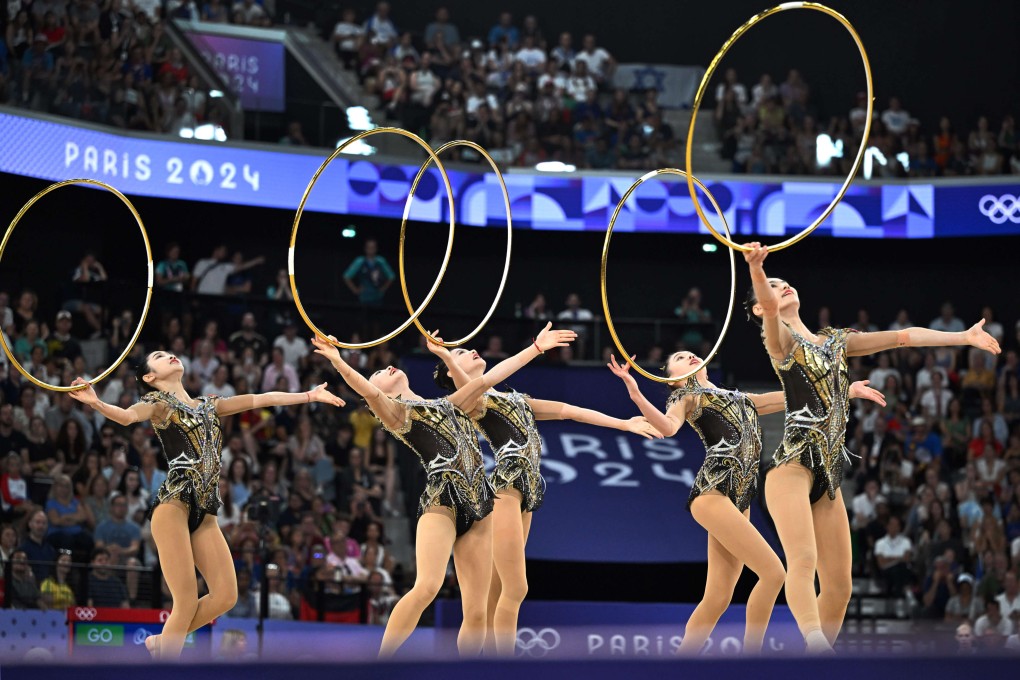 The five-woman Chinese team posted a total of 69.800 points in the final, which had two routines: one using hoops, the other using ribbons and balls. Photo: Xinhua