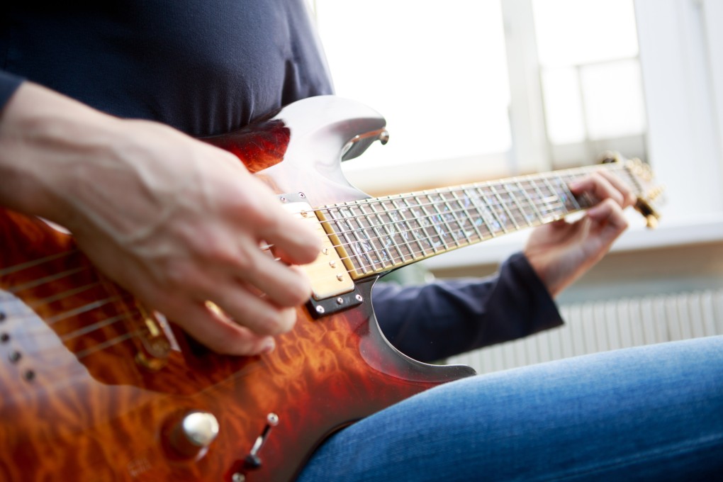 Flow, the feeling of being “in the zone”, is when we are so immersed in an activity such as playing a musical instrument that our actions seem to happen automatically. A team of neuroscientists studied jazz guitarists to find out how to achieve a flow state and what the brain does during it. Photo: Shutterstock