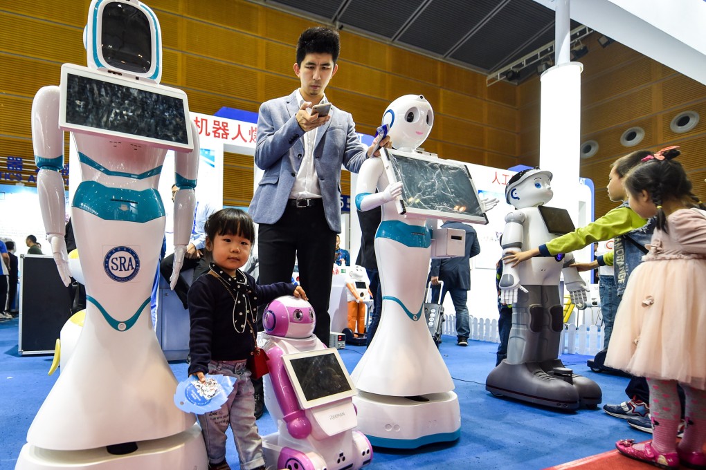 Children interact with robots during the 19th China Hi-tech Fair in Shenzhen on November 20, 2017. Photo: Xinhua