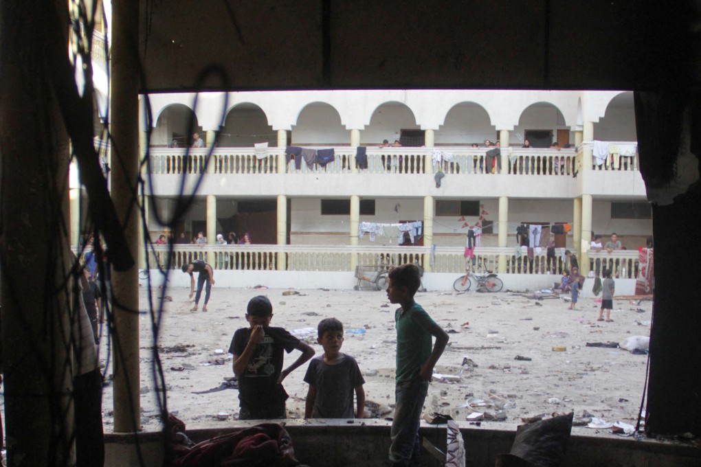 Palestinians look at the damage at the site of an Israeli strike on a school sheltering displaced people in Gaza on August 10, 2024. Photo: Reuters