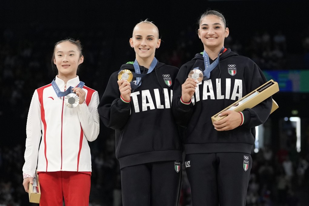 Zhou Yaqin (left) on the podium for the individual women’s artistic gymnastics provided a heartwarming Paris Olympics moment. Photo: AP