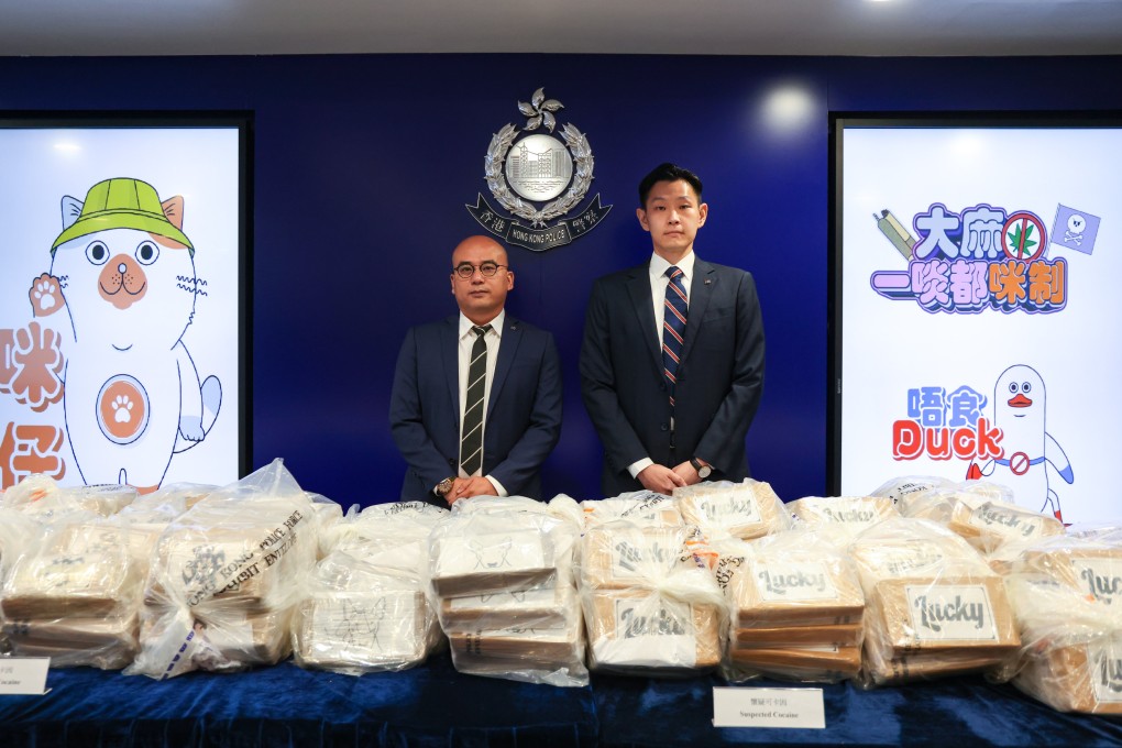 Chief Inspector Charm Yiu-kwong (left) and Senior Inspector Tong Wai-kwok pose for pictures with the drugs seized. Photo: Jelly Tse