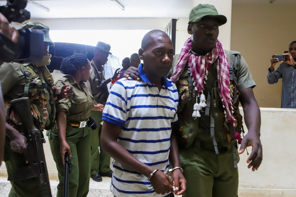 Paul Mackenzie, a Kenyan cult leader accused of ordering his followers to starve themselves to death in Shakahola forest, is escorted to the law courts in Malindi. Photo: Reuters