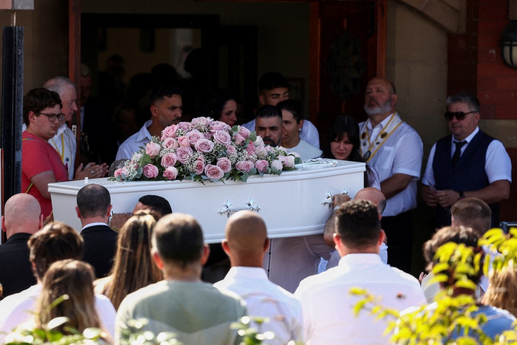 Alexandra and Sergio Aguiar, the parents of Alice da Silva Aguiar, stand near her coffin at St Patrick’s Catholic Church, in Southport, UK on Sunday. Photo: Reuters