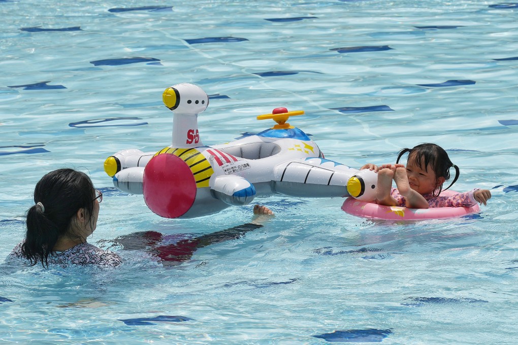 A child floats at Hammer Hill Road Swimming Pool on May 30. Swimming proficiency should be improved among young people in Hong Kong, both to equip the community with an important skill and to develop future Olympic champions. Photo: Elson Li