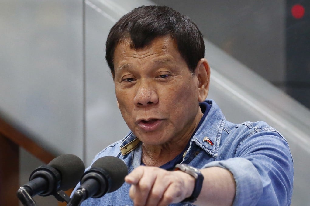 Then-Philippine president Rodrigo Duterte addresses Filipino overseas workers in 2018 at the Ninoy Aquino International Airport in Manila. Photo: AP