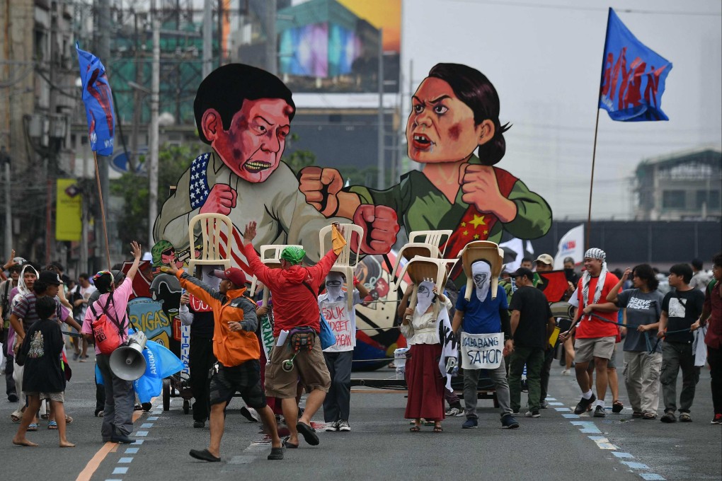 Effigies of Philippine President Ferdinand Marcos Jnr (left) and Vice-President Sara Duterte are seen as protesters march to congress during a demonstration coinciding with Marcos Jnr’s State of the Nation Address, in Manila on July 22. Photo: AFP