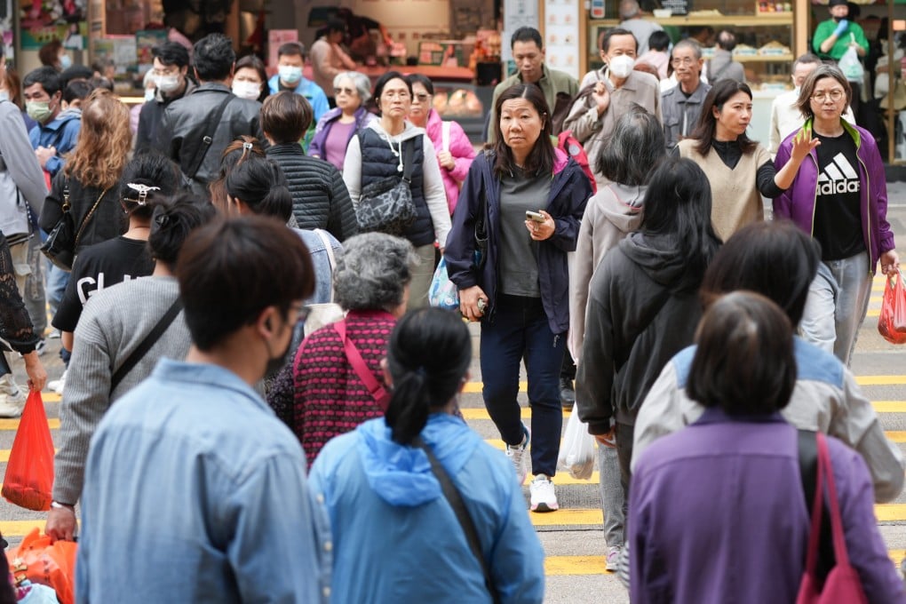 Pedestrians cross crowded Argyle Street in Mong Kok on January 2, 2024. Photo: Eugene Lee
