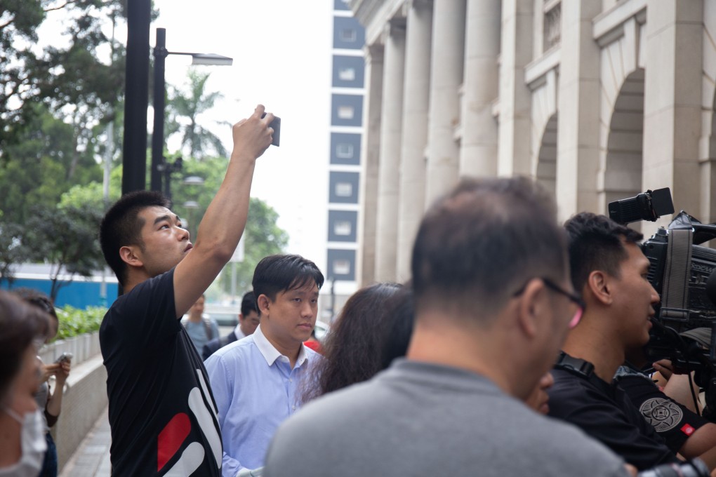 Tourists take pictures of a press event outside the Court of Final Appeal. File photo: Brian Wong