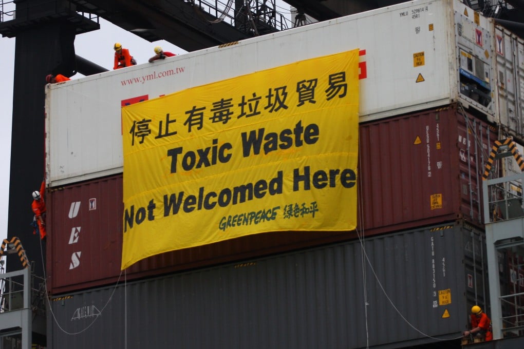 Greenpeace activists prevented the offloading of a container of waste electronic devices from the US, on its way to China, via Hong Kong in June 2018. Thai authorities are racing to stop about 100 shipping containers allegedly filled with hazardous industrial waste from reaching the nation’s ports. Photo: SCMP
