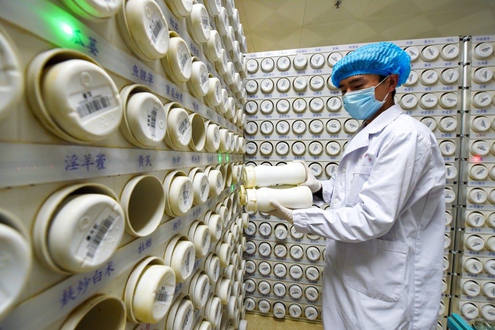 A pharmacist sorts granules of traditional Chinese medicine (TCM) at the Gansu Provincial Hospital of TCM in Lanzhou, Gansu province. Photo: Xinhua