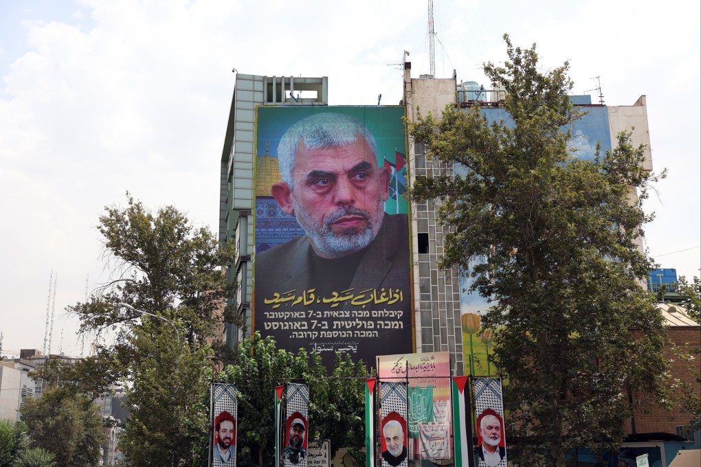 A billboard with a photo of new Hamas leader Yahya al-Sinwar hangs on a wall at Palestine Square in Tehran, Iran on Monday. Photo: EPA-EFE