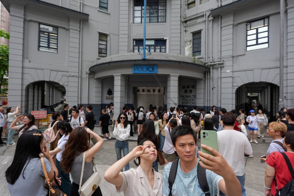 Tourists take photos at the former Yau Ma Tei police station on May 2, as the spot trends on Xiaohongshu, the social media platform. Photo: Eugene Lee