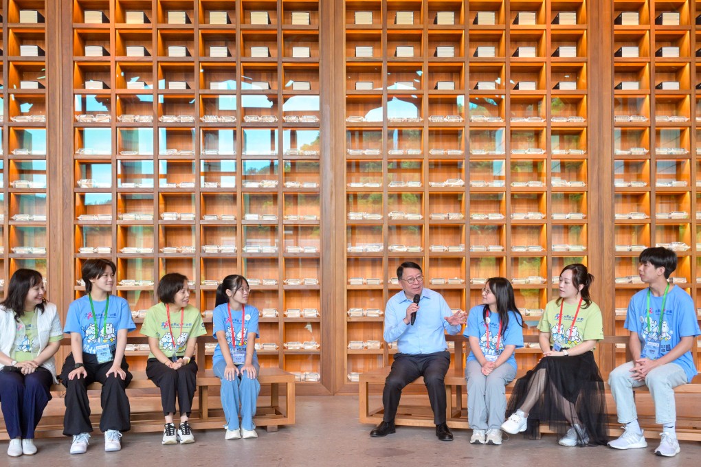 Chief Secretary Eric Chan (fourth from right) speaks to attendees of a talent mentorship programme at the Hangzhou National Archives of Publications and Culture. Photo: Handout