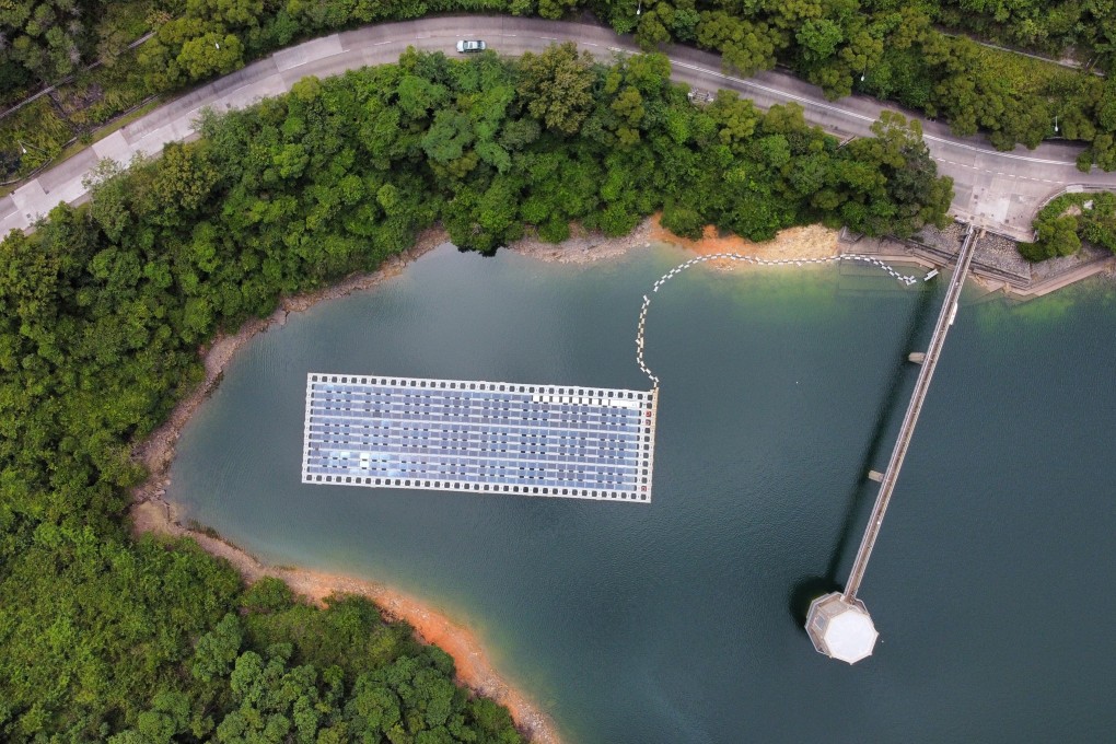 A photovoltaic system installed by the Water Supplies Department floats at the Shek Pik Reservoir to collect reference data for the future implementation of large-scale floating solar farms on reservoirs in Hong Kong, in September 2021. Photo: Martin Chan