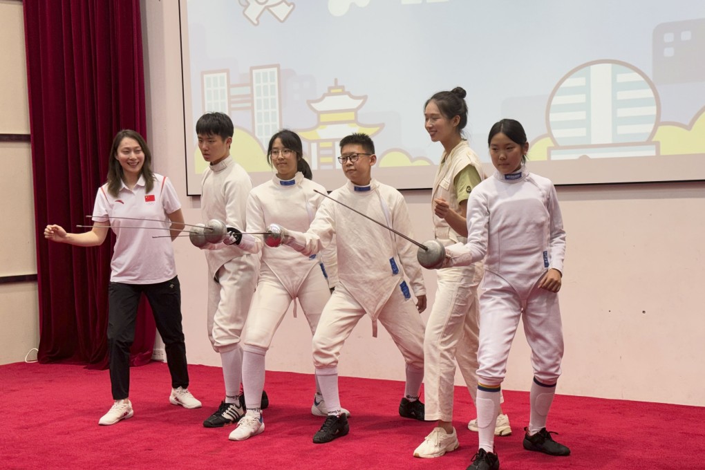 Vivian Kong (second right) poses with fencers from the team at the Hangzhou Chenjinglun Sports School.  Photo: Lo Hoi-ying