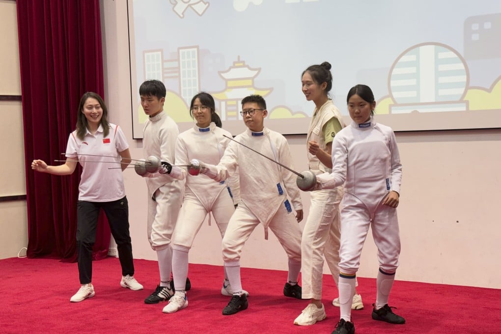 Vivian Kong (second right) poses with fencers from the team at the Hangzhou Chenjinglun Sports School. Photo: Lo Hoi-ying