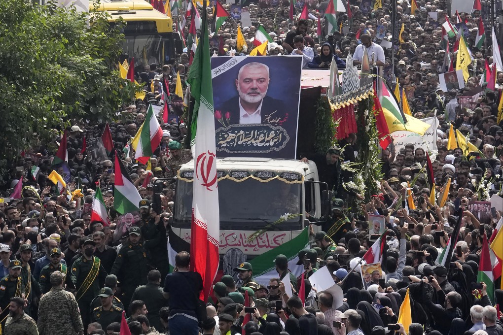 Iranians follow a truck carrying Hamas leader Ismail Haniyeh’s coffin during the funeral ceremony in Tehran on August 1. Photo: AP