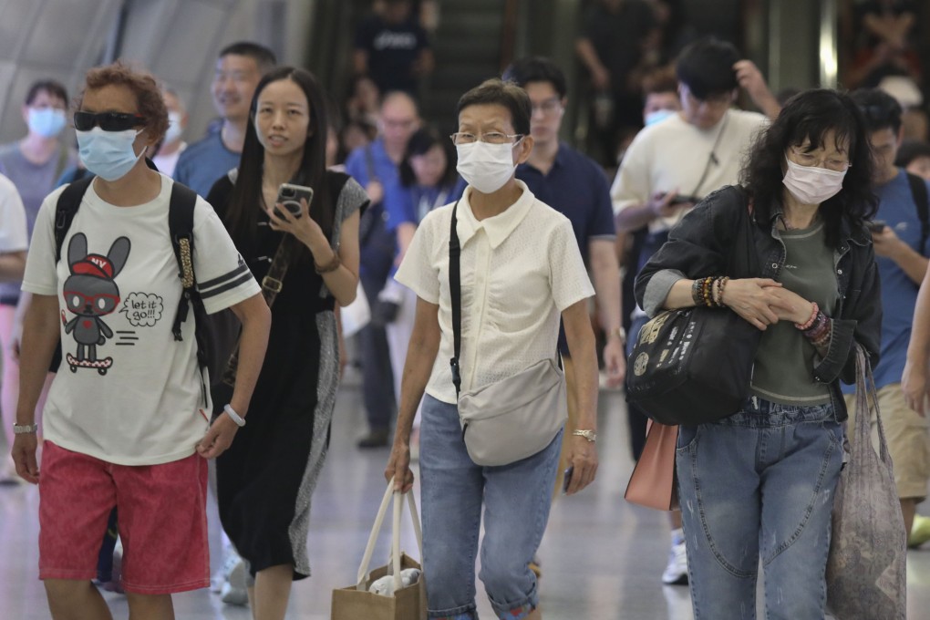 Passengers are seen wearing masks at Admiralty MTR station on Saturday. Photo: Xiaomei Chen