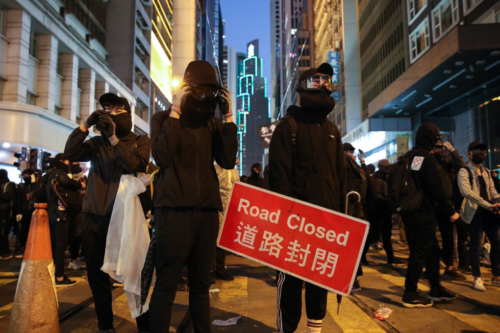 Black-clad protesters occupying a section of Des Voeux Road Central in Central on December 8, 2019. Photo: Winson Wong