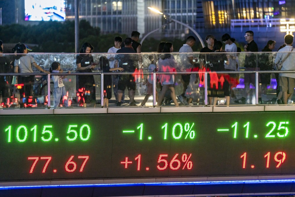 An electronic ticker displays stock data in Shanghai. Turnover on China’s exchanges have fallen amid investor apathy. Photo: Bloomberg