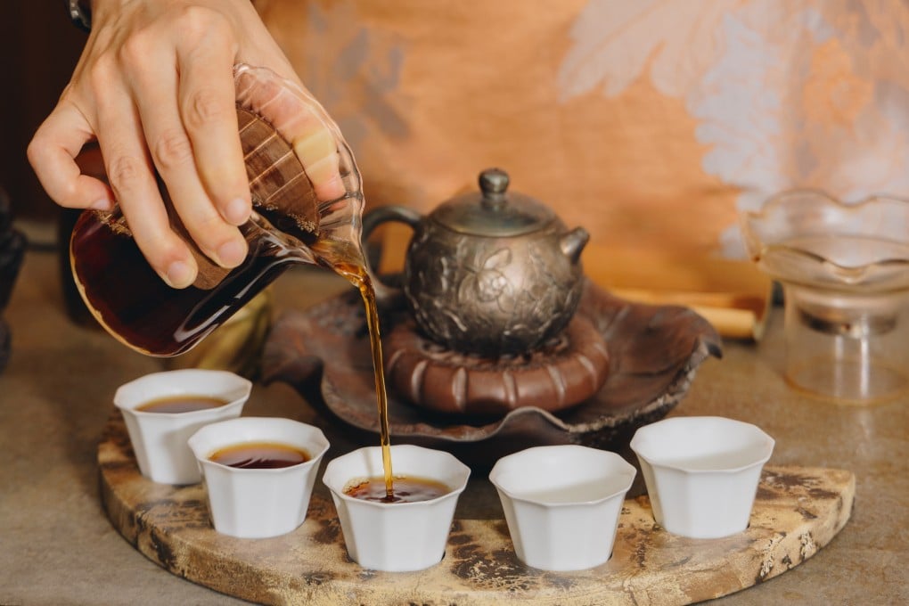 Cups of 1989 vintage camphor wood-scented raw Puer are prepared at Being & Tea. Photo: Jocelyn Tam