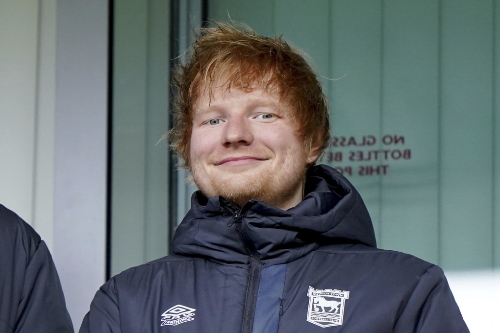 New Ipswich Town minority shareholder and life-long fan Ed Sheeran in the stands before a Championship match at Portman Road. Photo: AP